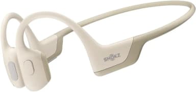 Shokz OpenRun Pro beige bone conduction headphones for workouts.