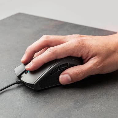 Hand using HyperX Pulsefire FPS Pro mouse, showing its comfortable grip